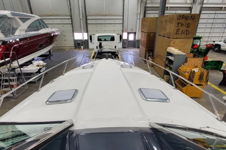 Slide: The Image of 2016 Formula 370 Super Sport boat in a storage facility, viewed from the bow. - 7