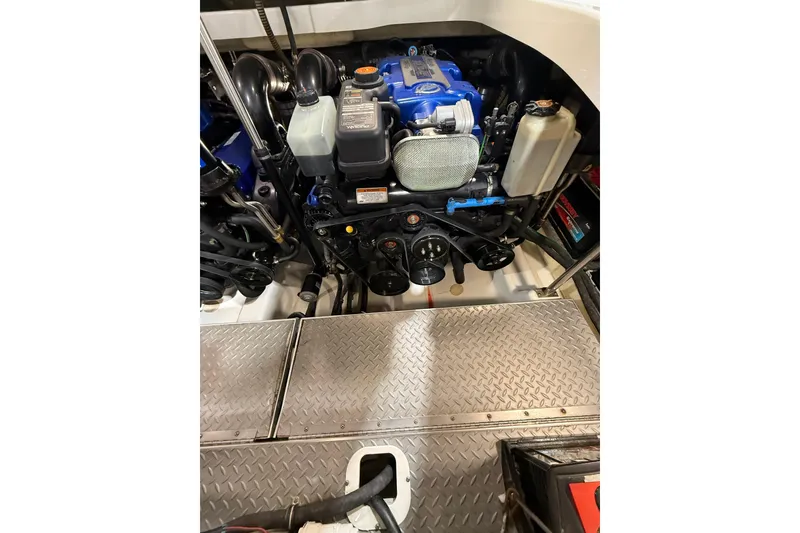 Slide: The Image of Engine compartment of a 2016 Formula 370 Super Sport boat, showcasing mechanical components. - 70