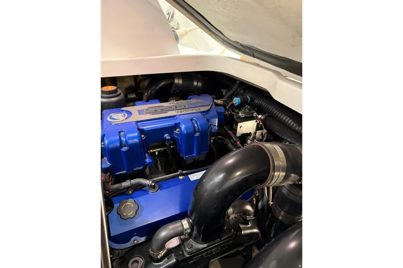 Slide: The Image of Engine compartment of a 2016 Formula 370 Super Sport boat, featuring a blue engine. - 72