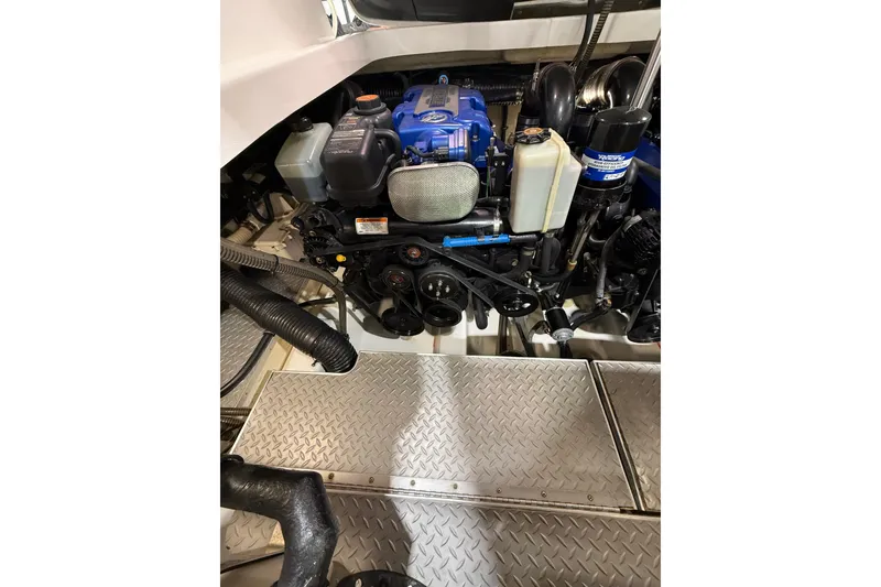 Slide: The Image of Engine compartment of a 2016 Formula 370 Super Sport boat, featuring detailed mechanical components. - 79