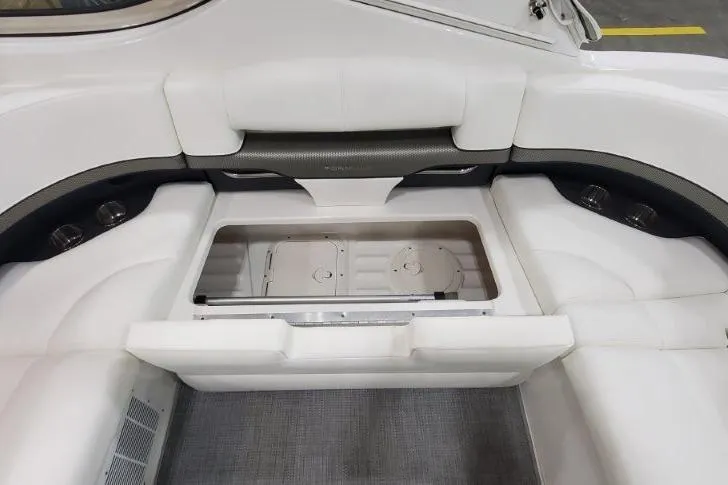 Slide: The Image of 2016 Formula 370 Super Sport boat interior with white seating and storage compartment. - 8