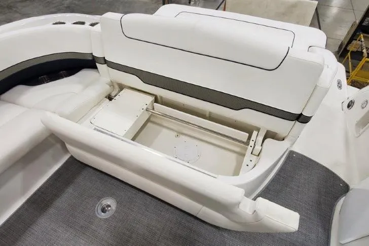 Slide: The Image of 2016 Formula 370 Super Sport boat interior with white seating and storage compartment. - 9
