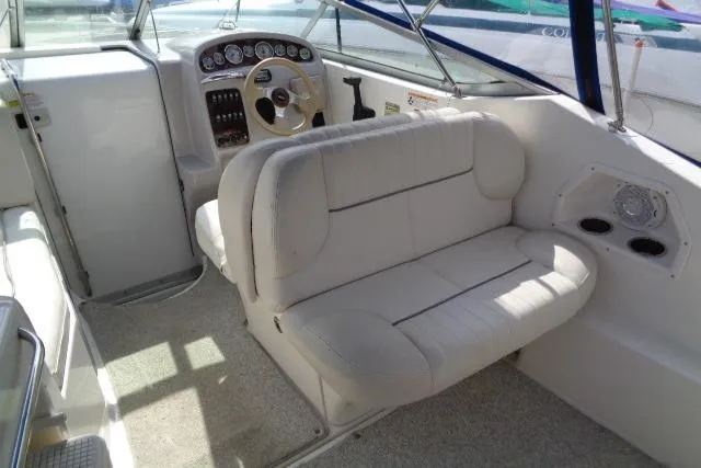 Slide: The Image of 2006 Chaparral Signature 240 boat interior with steering wheel and cushioned seating. - 10