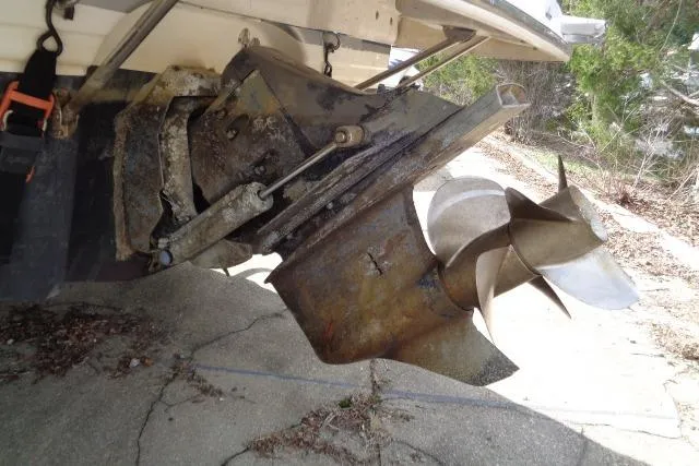 Slide: The Image of 2006 Chaparral Signature 240 boat propeller and stern drive, showing wear and rust. - 29