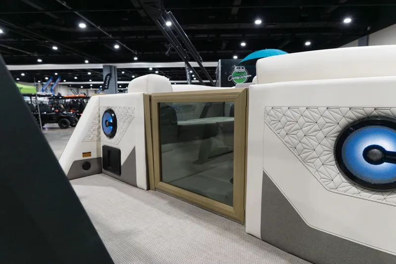 Slide: The Image of Alera M23Q 2026 model interior with modern speaker system and quilted design. - 19