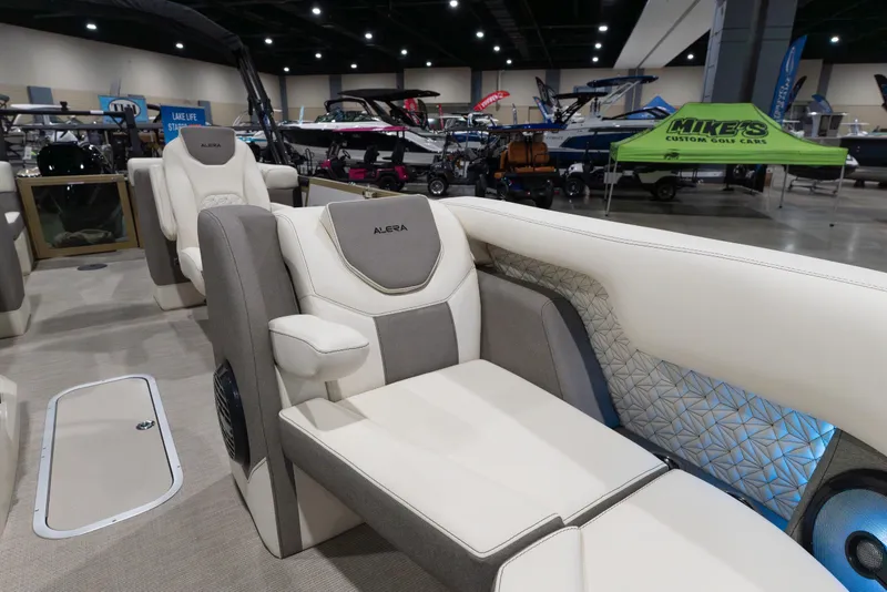 Slide: The Image of Luxurious interior of 2026 Alera M23Q boat at a showroom, featuring plush seating. - 5