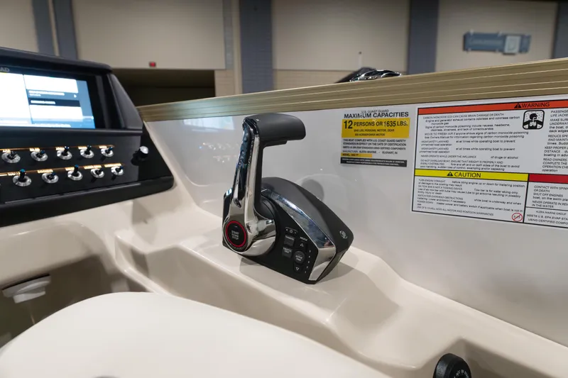 Slide: The Image of Control panel of 2026 Alera M23Q boat with capacity and safety warnings. - 9