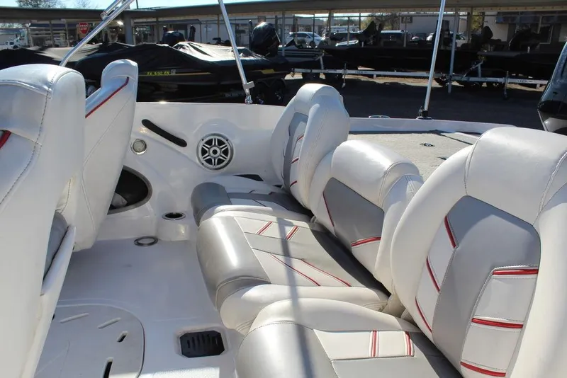 Slide: The Image of 2018 Nitro Z19 Sport boat interior with white and red-accented seats. - 13