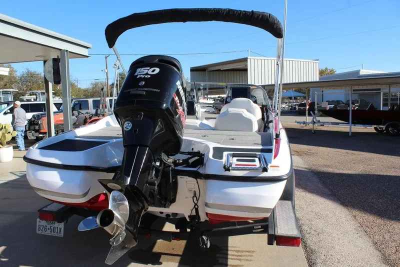 Slide: The Image of 2018 Nitro Z19 Sport boat with Mercury 150 Pro XS engine, parked on a trailer. - 2