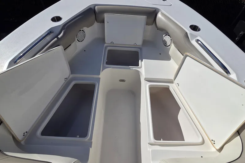 Slide: The Image of 2020 Key West 239 DFS boat interior with open storage compartments. - 16