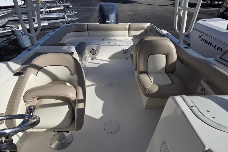 Slide: The Image of 2020 Key West 239 DFS boat interior with seating and steering wheel. - 17