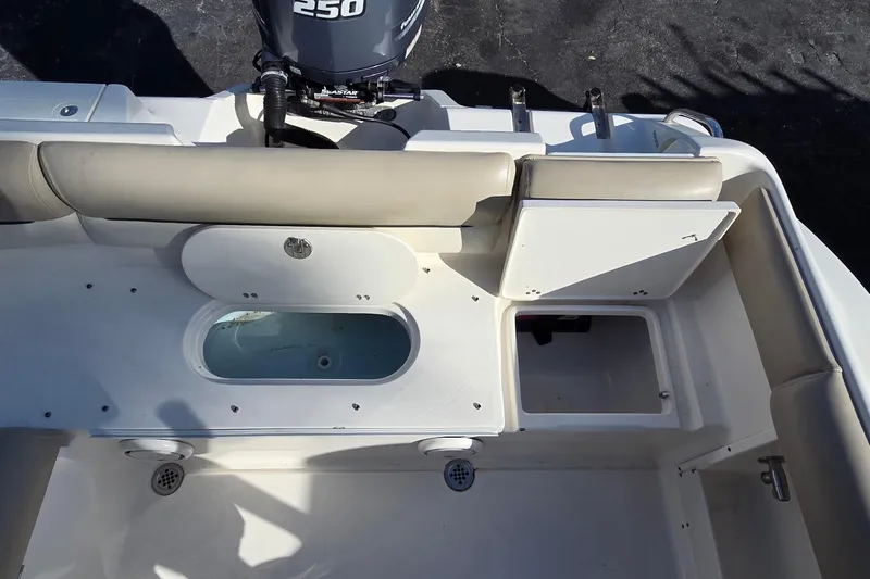 Slide: The Image of 2020 Key West 239 DFS boat interior with seating and storage compartments. - 18