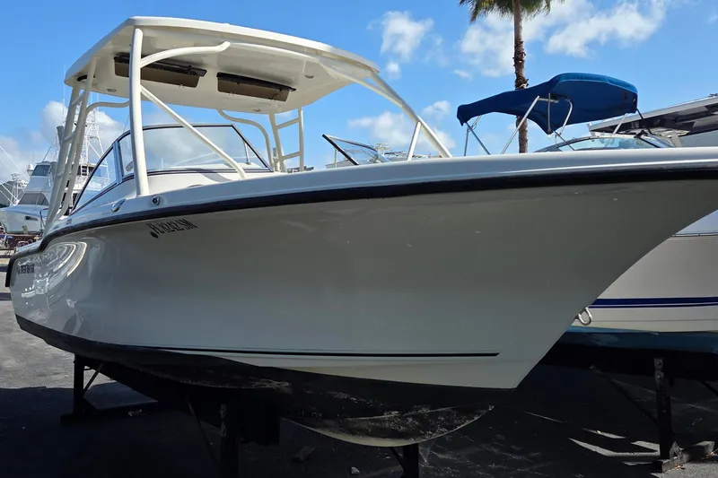 Slide: The Image of 2020 Key West 239 DFS boat displayed outdoors under a clear blue sky. - 3