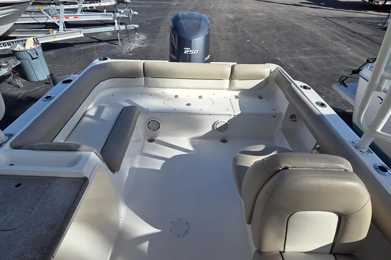 Slide: The Image of 2020 Key West 239 DFS boat interior with seating and Yamaha 250 engine. - 8