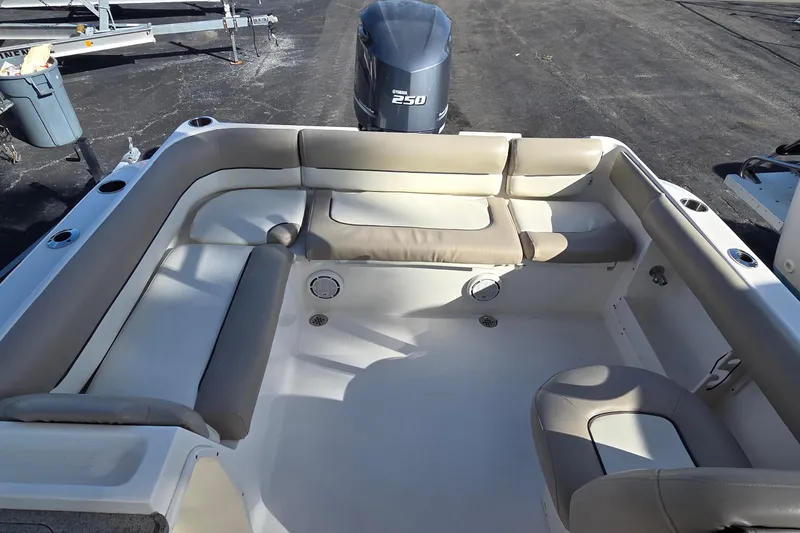 Slide: The Image of 2020 Key West 239 DFS boat interior with cushioned seating and Yamaha 250 engine. - 9