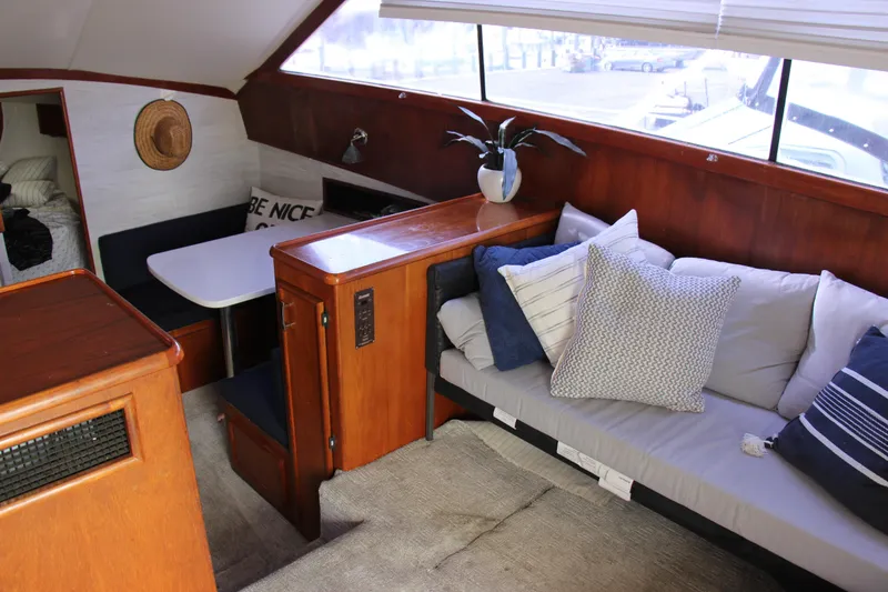 Slide: The Image of Interior of 1989 Ocean Yachts 35 Super Sport with cozy seating and dining area. - 13