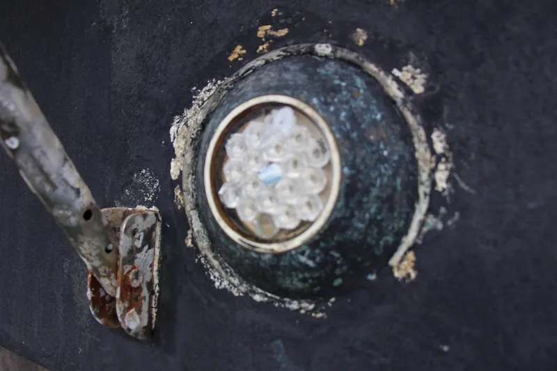 Slide: The Image of Close-up of a weathered 1989 Ocean Yachts 35 Super Sport hull detail. - 26