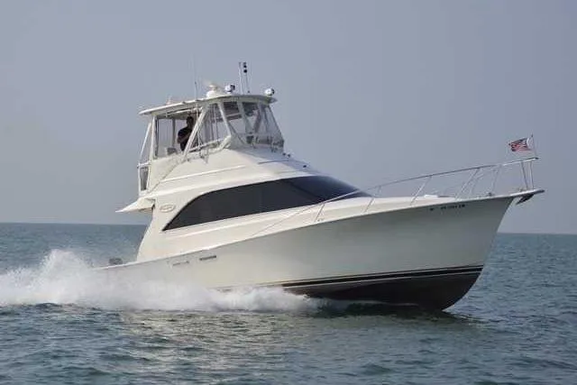 Slide: The Image of 1989 Ocean Yachts 35 Super Sport cruising on open water. - 27