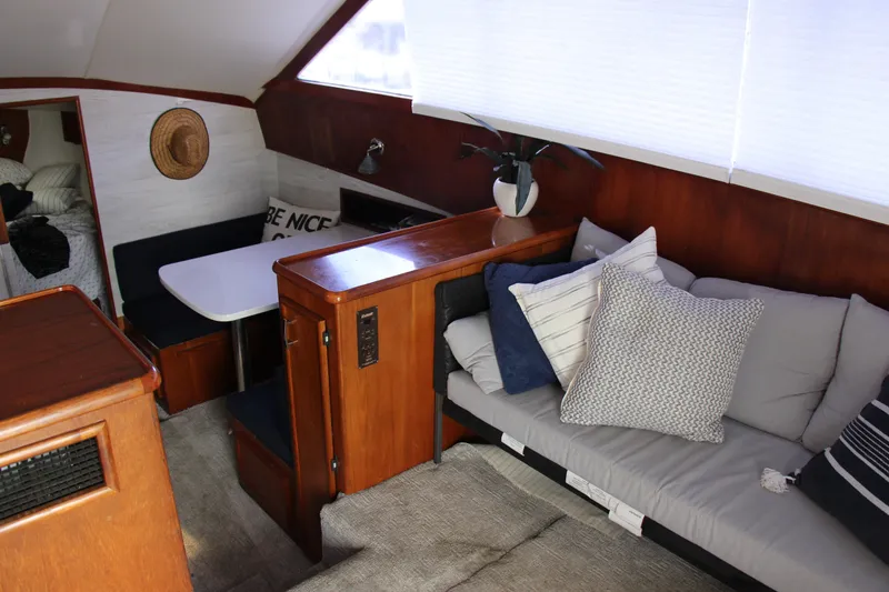 Slide: The Image of Interior of 1989 Ocean Yachts 35 Super Sport with cozy seating and dining area. - 10
