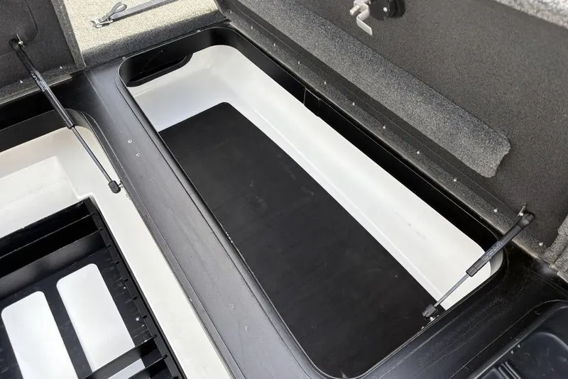 Slide: The Image of 2023 Skeeter ZXR21 boat storage compartment with hydraulic lift supports. - 15