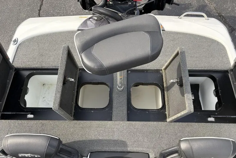Slide: The Image of 2023 Skeeter ZXR21 boat interior with open storage compartments and seating. - 24