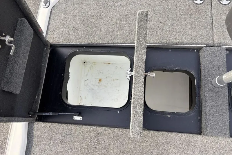 Slide: The Image of Open storage compartments on 2023 Skeeter ZXR21 boat deck. - 25