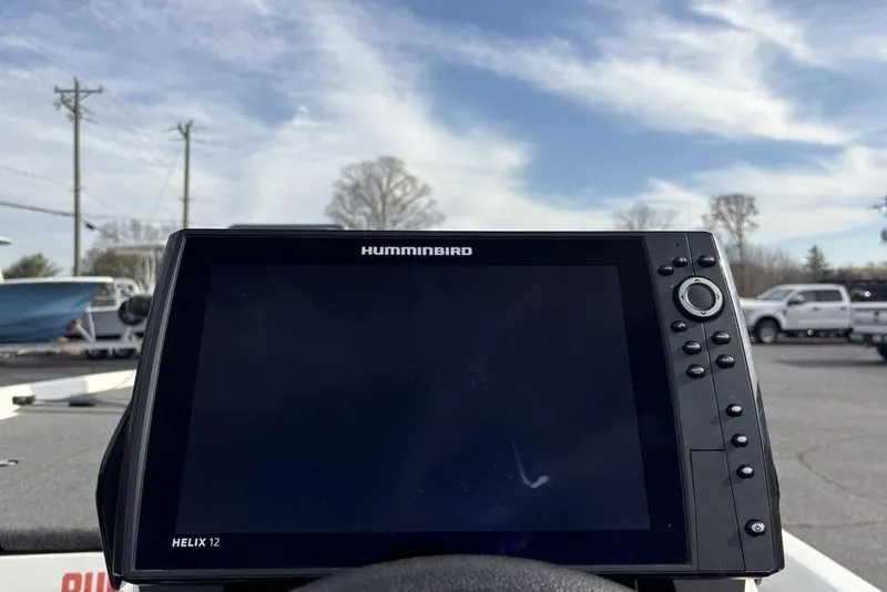 Slide: The Image of Humminbird Helix 12 fishfinder on 2023 Skeeter ZXR21 boat, parked outdoors. - 28