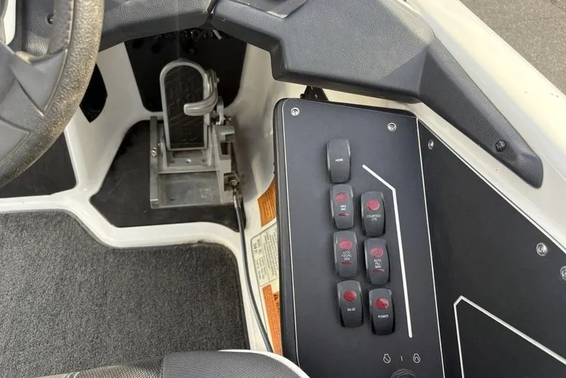 Slide: The Image of 2023 Skeeter ZXR21 boat dashboard with control panel and foot pedal. - 29