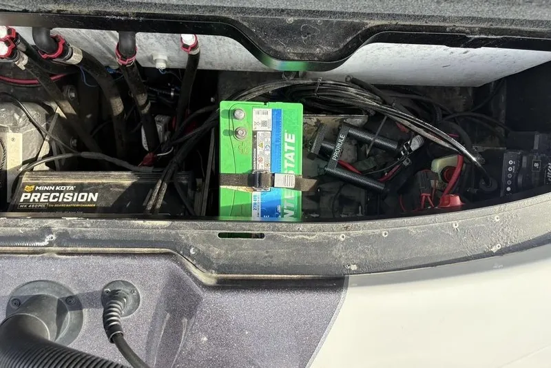 Slide: The Image of 2023 Skeeter ZXR21 boat battery compartment with Minn Kota Precision charger. - 35