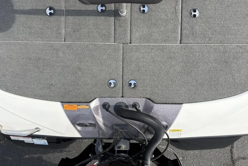 Slide: The Image of 2023 Skeeter ZXR21 boat deck with gray carpet and hardware details. - 38