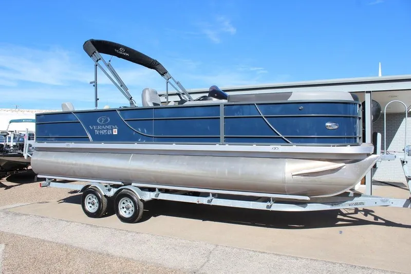 The Image of 2022 Veranda VF22F2 Bi-Toon pontoon boat on trailer, blue exterior, sunny day. - 1
