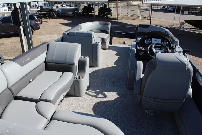Slide: The Image of 2022 Veranda VF22F2 Bi-Toon boat interior with gray seating and steering console. - 9