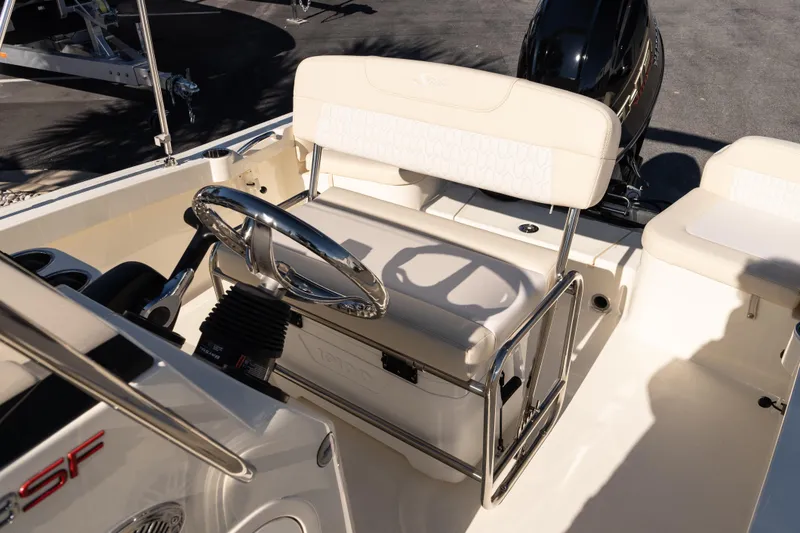 Slide: The Image of 2026 Scout 188 Sportfish boat interior with steering wheel and seating. - 10