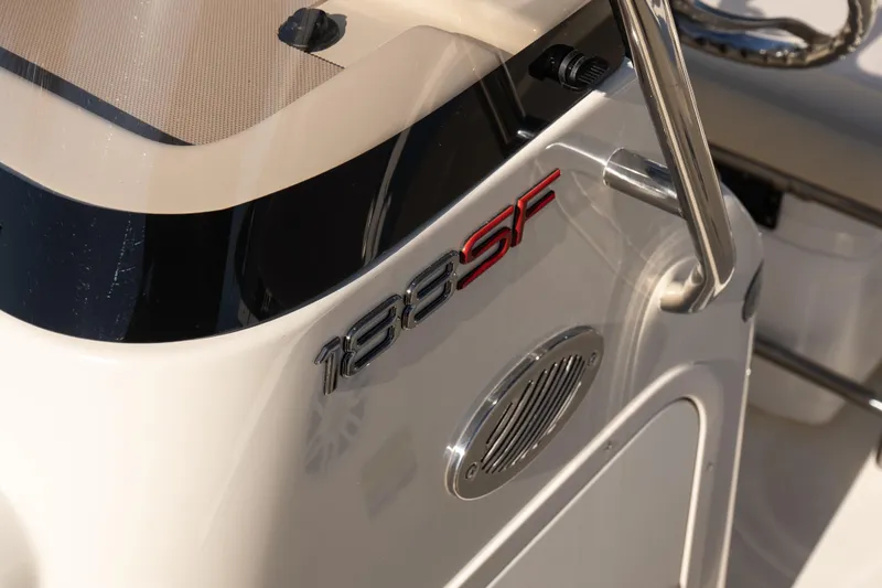 Slide: The Image of 2026 Scout 188 Sportfish boat console with logo and stainless steel details. - 11