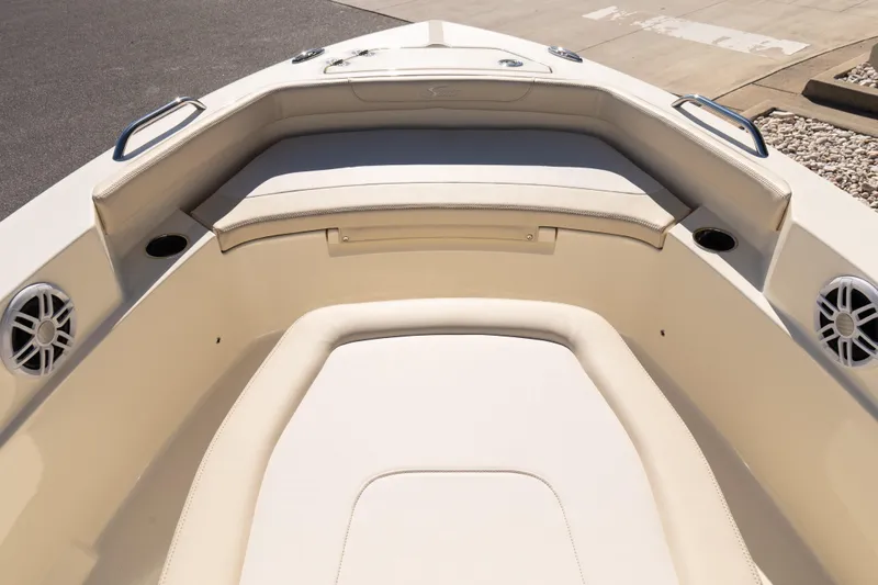 Slide: The Image of 2026 Scout 188 Sportfish boat interior with cushioned seating and cup holders. - 12