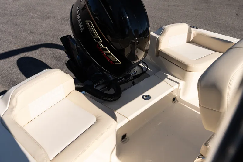 Slide: The Image of 2026 Scout 188 Sportfish boat with Yamaha engine, featuring beige seating. - 7
