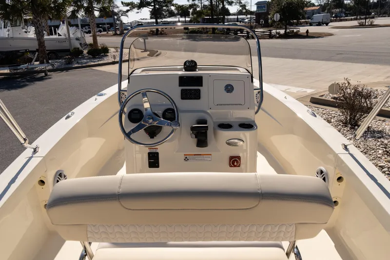 Slide: The Image of 2026 Scout 188 Sportfish boat interior with steering wheel and control panel. - 8