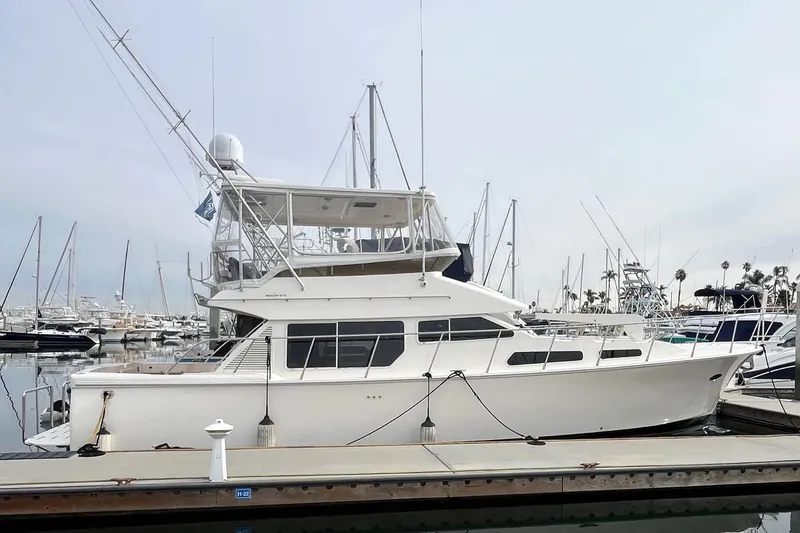 The Image of 2001 Mikelson Luxury Sportfisher yacht docked at marina, side view. - 0