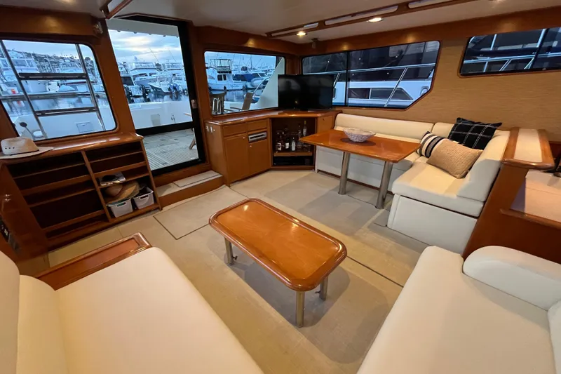Slide: The Image of Luxurious interior of a 2001 Mikelson Luxury Sportfisher yacht with elegant seating and wood finishes. - 15