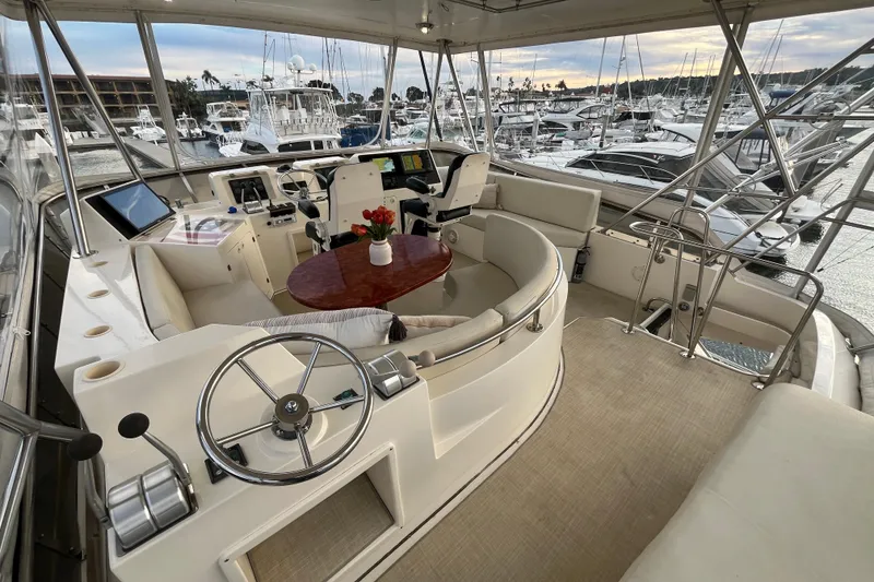Slide: The Image of Luxurious 2001 Mikelson Sportfisher yacht interior with helm, seating, and marina view. - 35