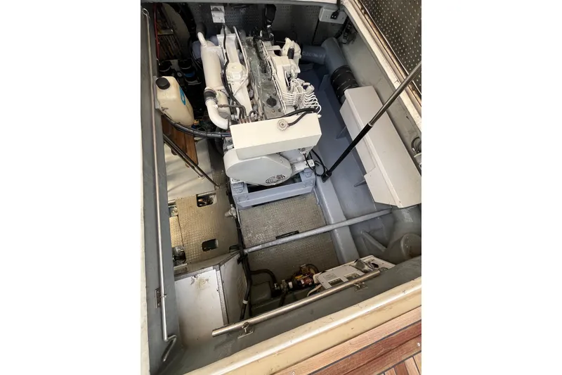 Slide: The Image of Engine compartment of a 2001 Mikelson Luxury Sportfisher boat, showcasing mechanical components. - 46