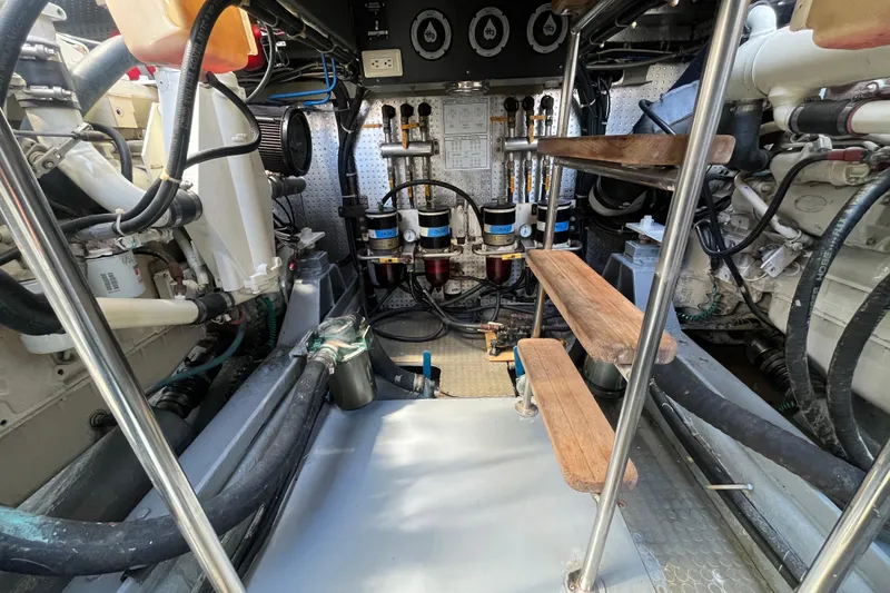 Slide: The Image of Engine room of a 2001 Mikelson Luxury Sportfisher with visible machinery and equipment. - 48