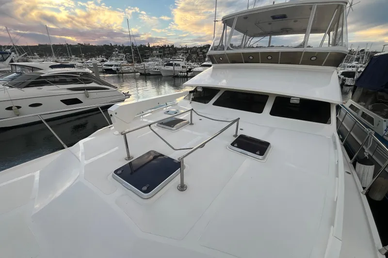 Slide: The Image of 2001 Mikelson Luxury Sportfisher yacht docked at marina during sunset. - 53