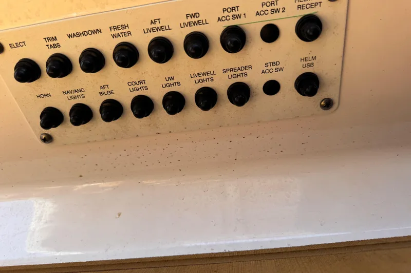 Slide: The Image of Control panel of 2021 Robalo R242 Center Console boat with labeled switches. - 22