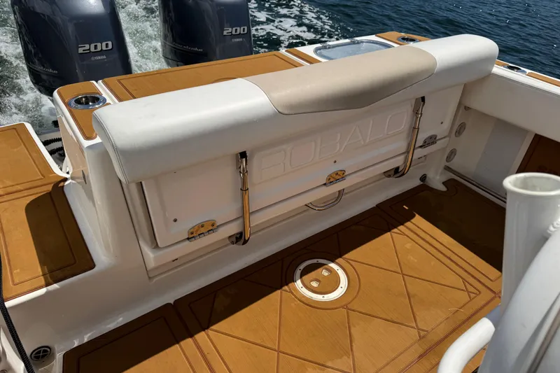 Slide: The Image of 2021 Robalo R242 Center Console boat interior with dual Yamaha 200 engines. - 8