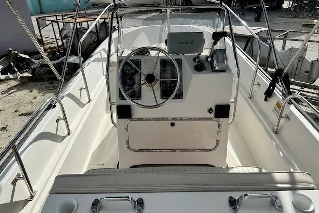 Slide: The Image of 1999 Boston Whaler 170 Montauk boat interior with steering console and navigation equipment. - 5