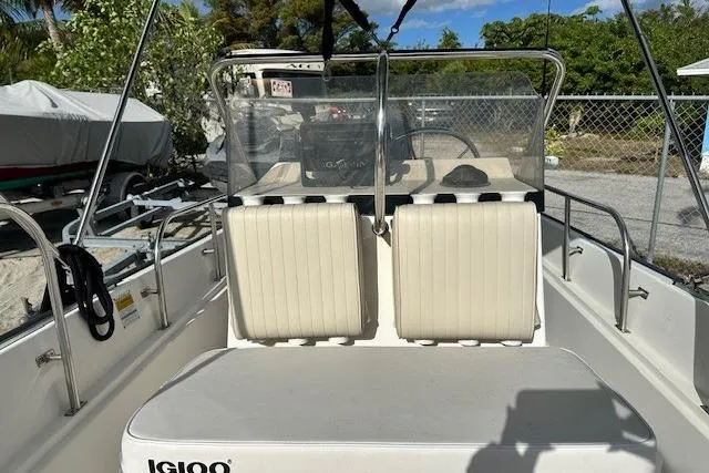 Slide: The Image of 1999 Boston Whaler 170 Montauk boat interior with seating and steering console. - 7
