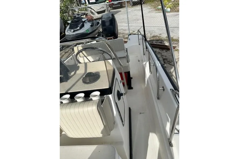 Slide: The Image of 1999 Boston Whaler 170 Montauk boat interior with steering wheel and seating. - 8
