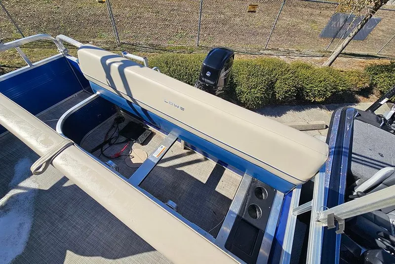 Slide: The Image of 2023 Lowe Ultra 180 Cruise boat interior with seating and motor, viewed from above. - 10