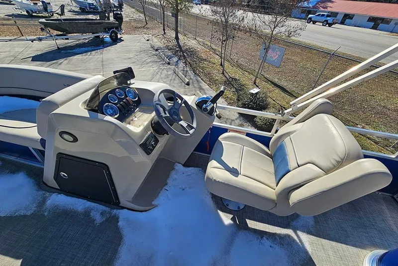 Slide: The Image of 2023 Lowe Ultra 180 Cruise boat interior with steering console and seating. - 11